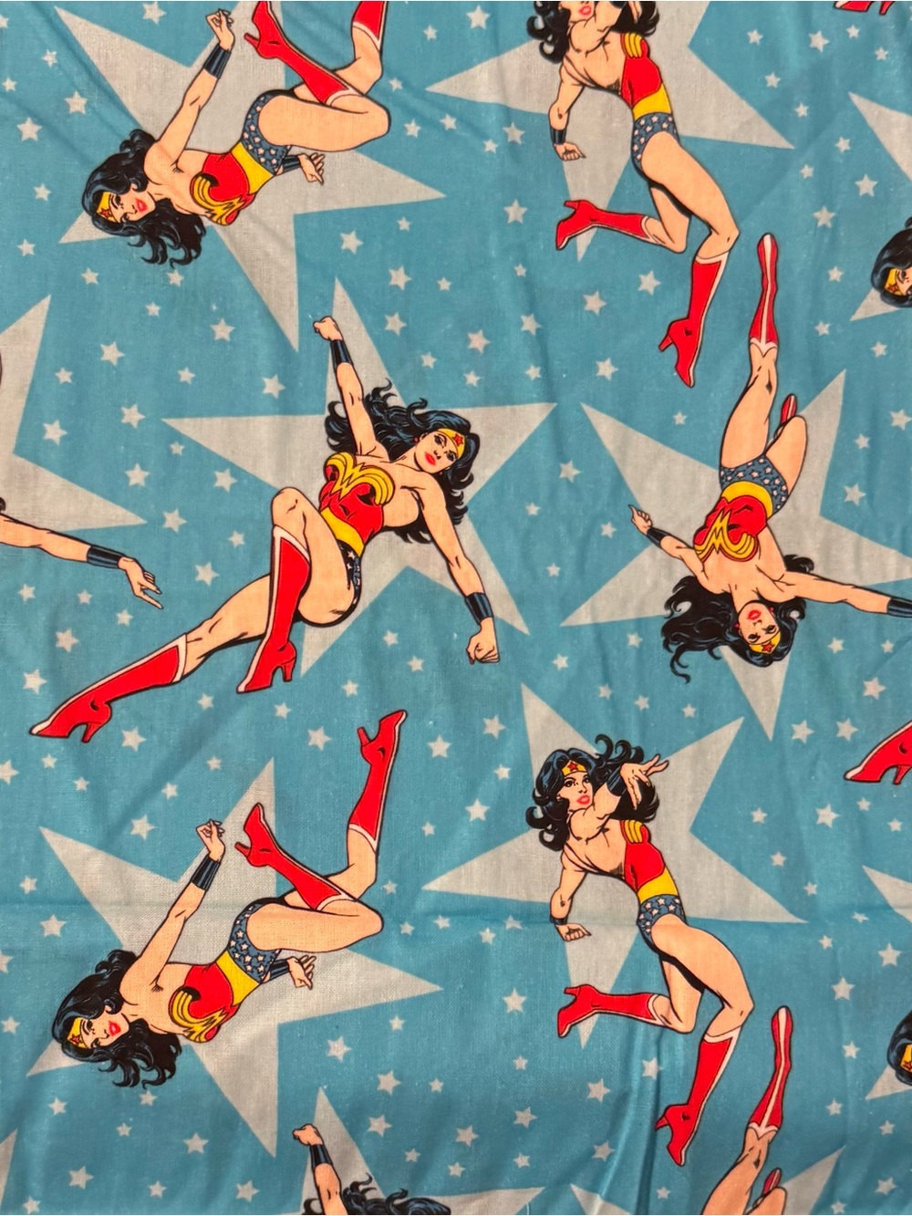Fabric Wonder Woman Teal/Blue Background. 3 Yards x 44/45” Wide. DC Comics